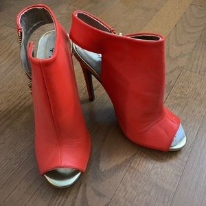 Bright orange stiletto open toes heels